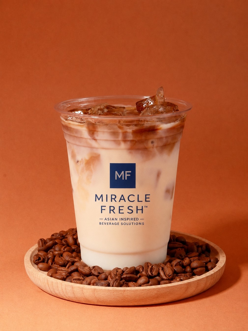 Layered iced latte with rye milk and espresso in a Miracle Fresh cup