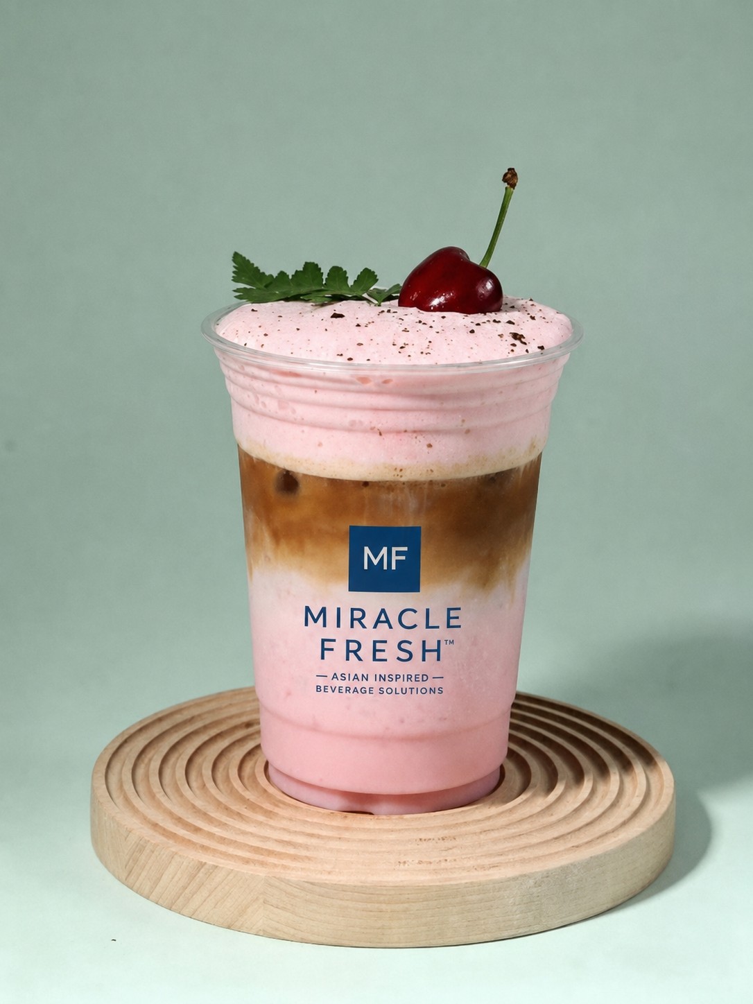 Oat milk black tea with cocoa and raspberry foam in a Miracle Fresh cup