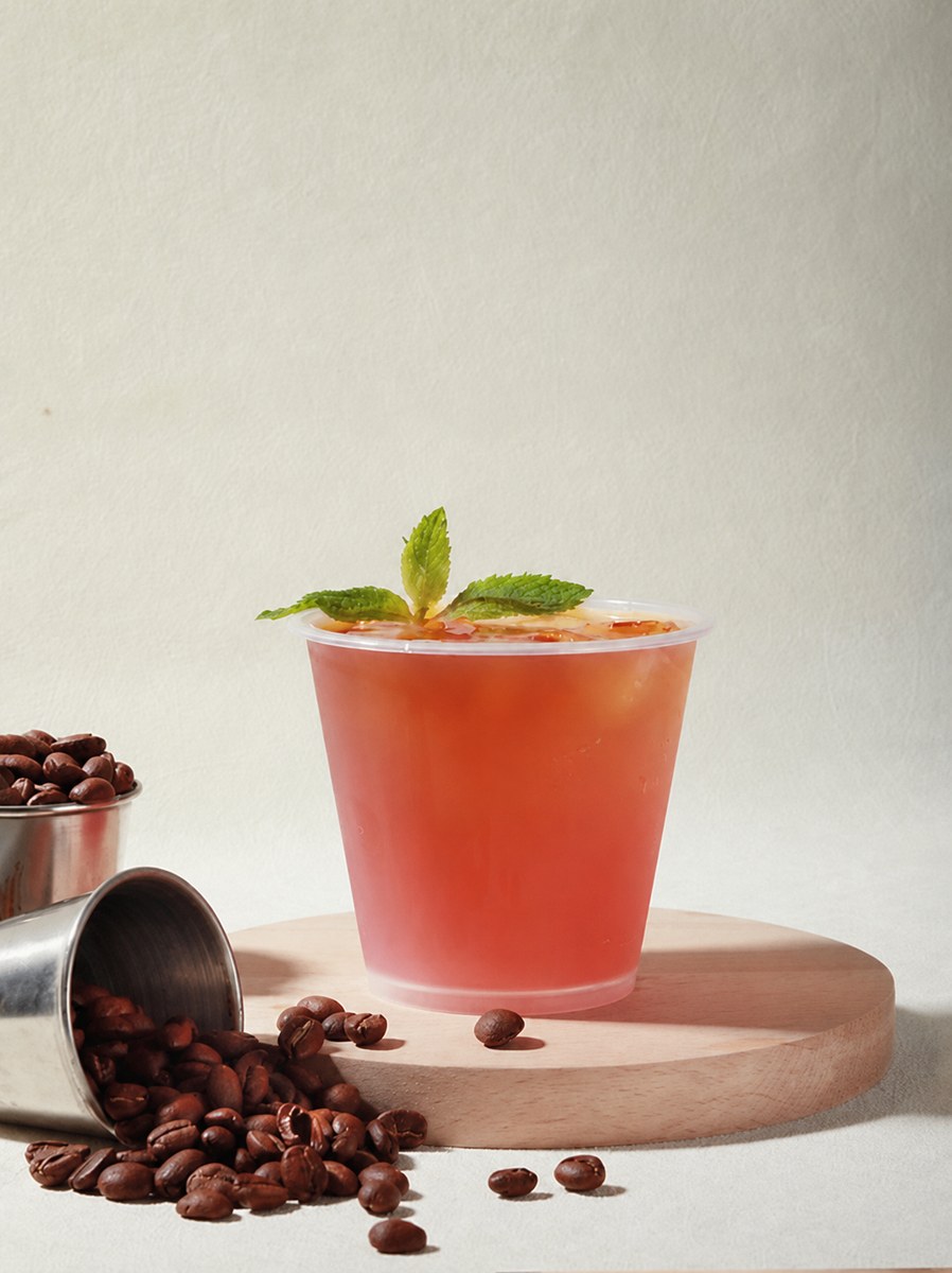 Layered white peach, perilla and cold-brew coffee drink
