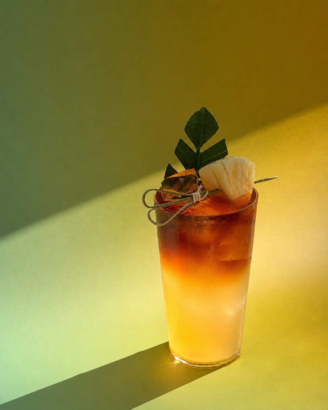 Pineapple, sugar apple and litsea coconut water beneath cold-brew coffee