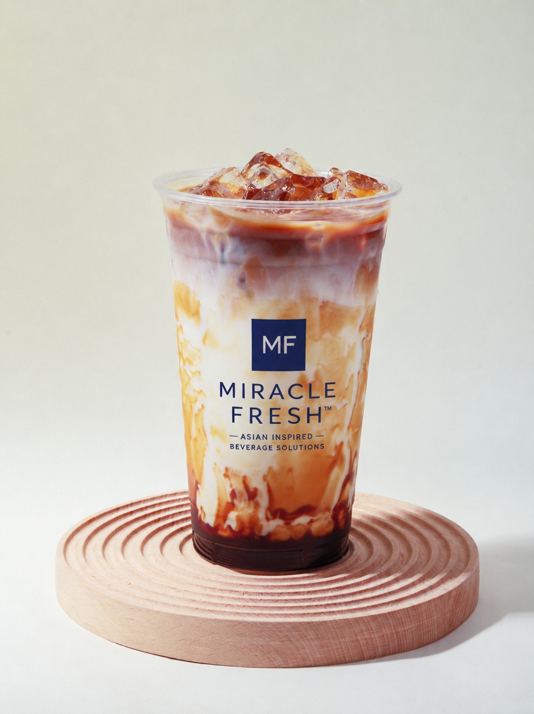 Brown sugar boba coconut drink in a clear cup