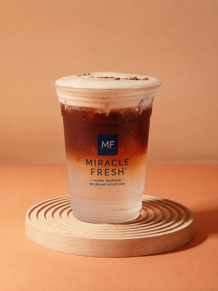 Coconut water and white pomelo refresher topped with coconut cloud foam