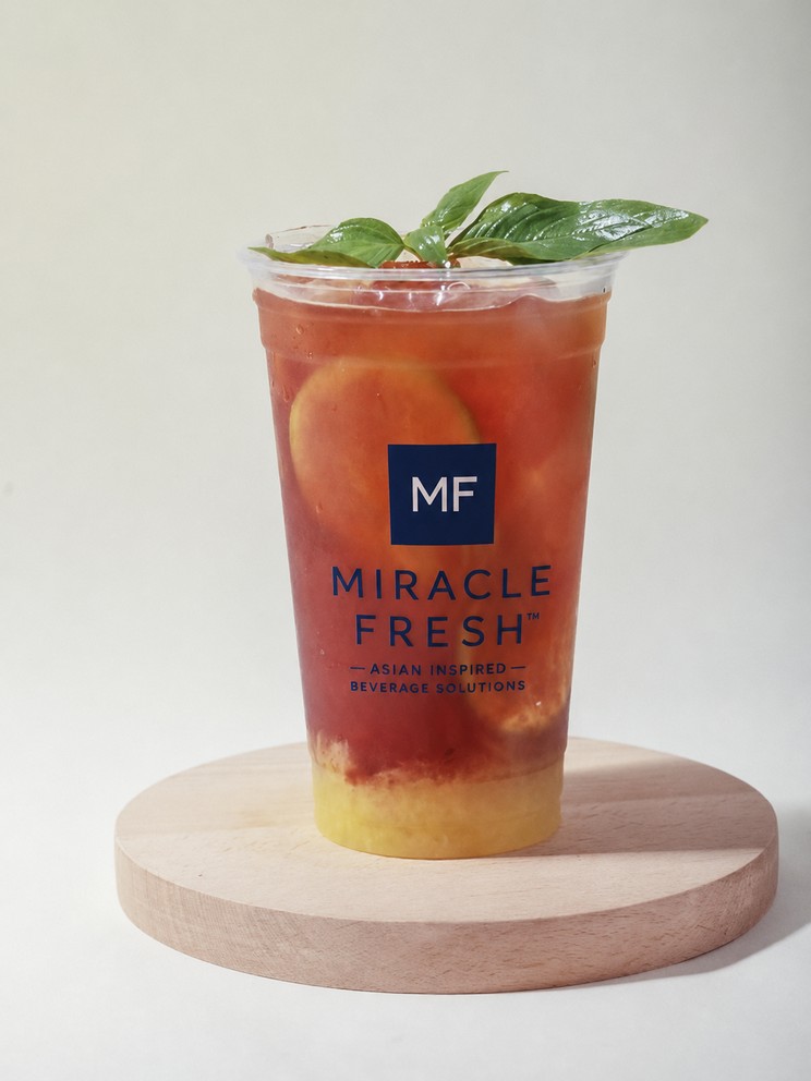 Iced cold brew with pineapple and osmanthus white tea in a Miracle Fresh cup