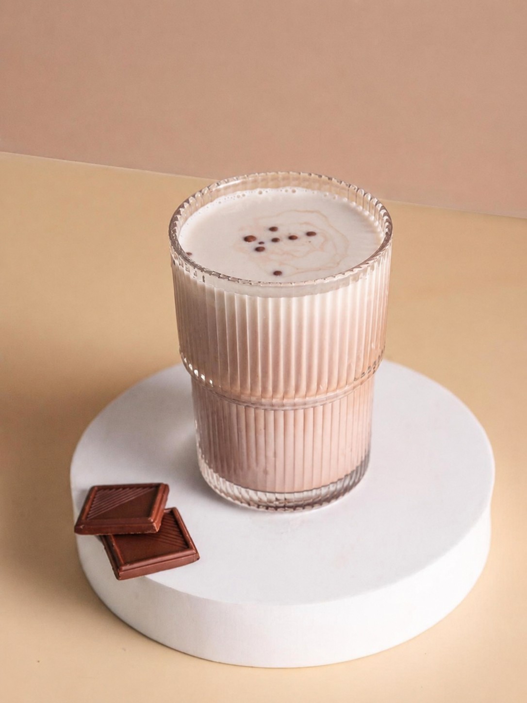 Dark chocolate coconut coffee served with pieces of dark chocolate