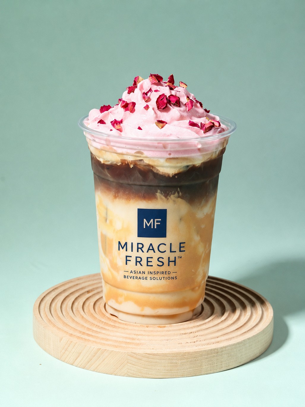 Iced cocoa coffee topped with rose-flavoured cheese foam and rose petals