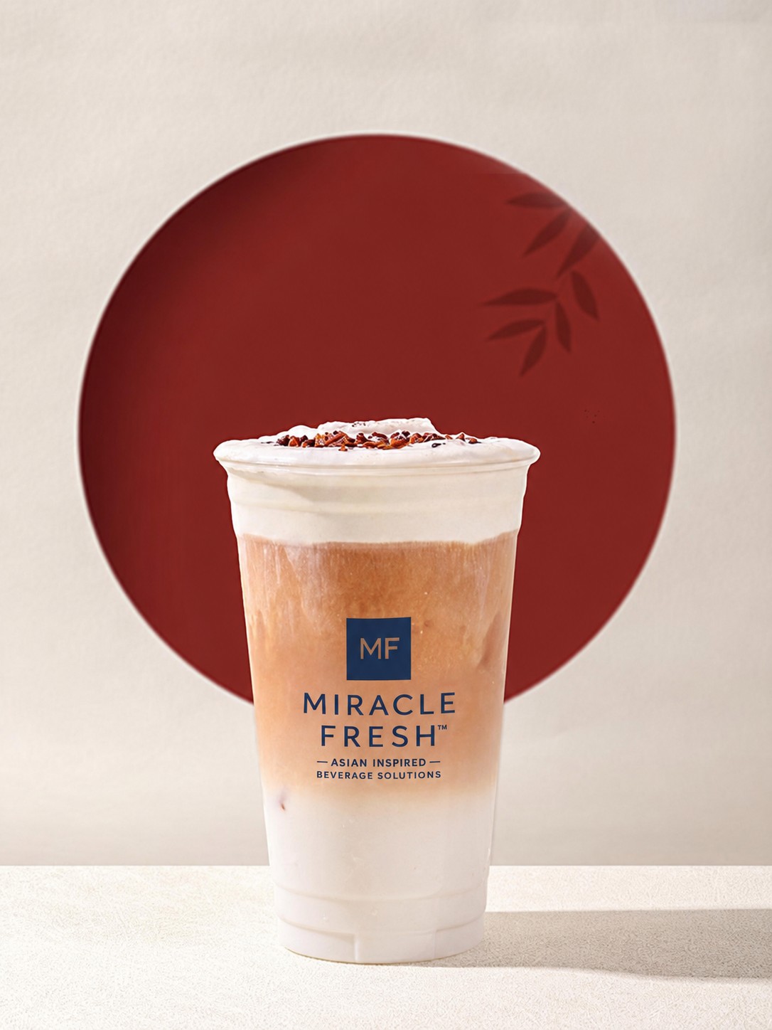 Oat milk tea topped with cheese and sour plum foam in a Miracle Fresh cup