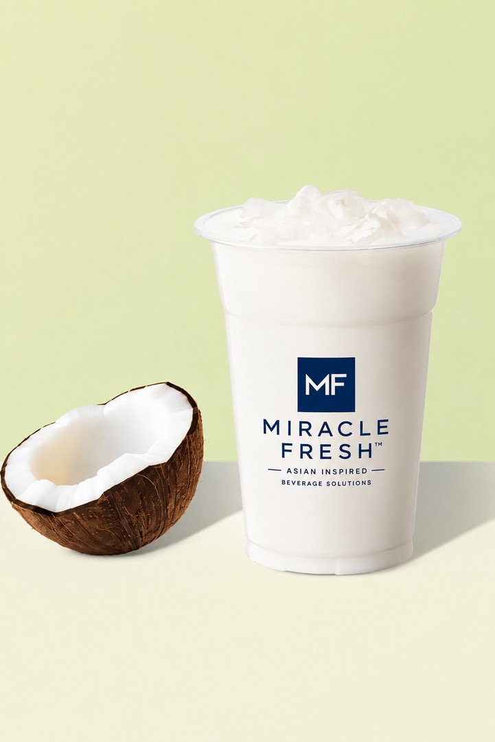 Fresh-Pressed Coconut Milk served in a Miracle Fresh cup